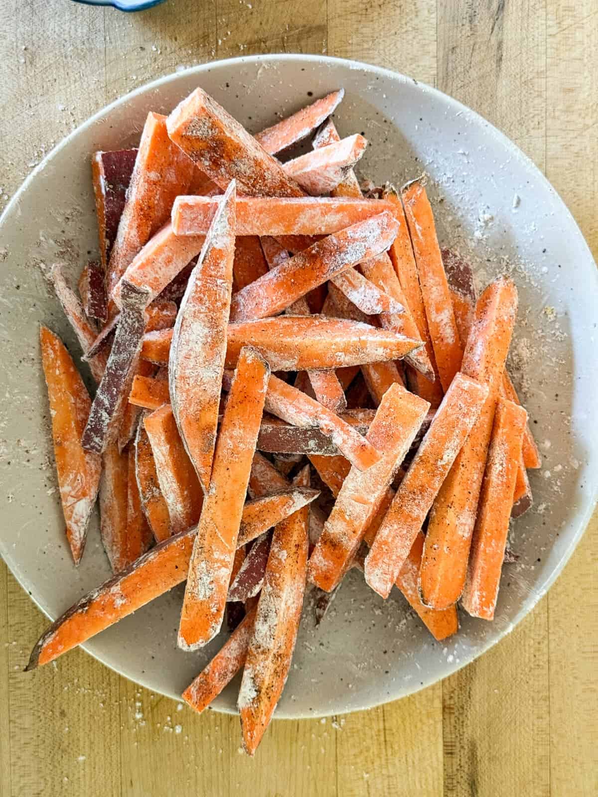 sweet potato fries with seasoning in a bowl