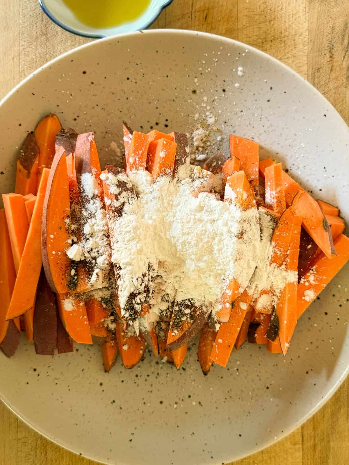 sweet potato fires tossed in cornstarch for a cripsy texture.